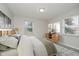 Cozy bedroom featuring neutral tones, comfortable bedding, and bright windows, creating a serene retreat at 91 N Raceway Rd, Indianapolis, IN 46234