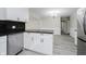 Open-concept kitchen featuring stainless steel appliances and adjacent dining area at 91 N Raceway Rd, Indianapolis, IN 46234