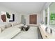 Bright living room with a modern aesthetic, featuring ample natural light and stylish decor elements at 91 N Raceway Rd, Indianapolis, IN 46234