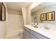 Bright bathroom boasts double sinks, modern fixtures, and a shower-tub combo at 921 Shadow Dr, Danville, IN 46122