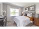 Inviting bedroom with large window and lots of natural light, bright white trim, and plush carpet at 921 Shadow Dr, Danville, IN 46122