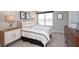 Bright bedroom features a large window, neutral walls, and stylish decor at 921 Shadow Dr, Danville, IN 46122