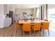 Open dining area with wooden table, seating for six, and views of the gourmet kitchen at 921 Shadow Dr, Danville, IN 46122