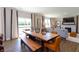 Light-filled dining room with view to great room features stylish decor, a wooden table, and seating at 921 Shadow Dr, Danville, IN 46122