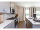 Contemporary kitchen featuring sleek countertops, stainless steel appliances, and ample cabinet space for storage at 921 Shadow Dr, Danville, IN 46122