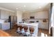 Modern kitchen with stainless steel appliances, a kitchen island with bar stools, and bright lighting at 921 Shadow Dr, Danville, IN 46122