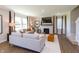 Bright living room featuring neutral tones, a fireplace, large windows, and comfortable seating arrangements at 921 Shadow Dr, Danville, IN 46122