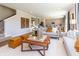 Open-concept living room featuring hardwood floors, modern decor, and abundant natural light from large windows at 921 Shadow Dr, Danville, IN 46122