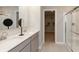 Modern main bathroom featuring double sinks, quartz countertops, and a glass enclosed shower at 921 Shadow Dr, Danville, IN 46122