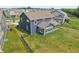 Aerial view of a home with a spacious backyard featuring a well-maintained lawn and an outdoor patio at 9671 Ridgecrest Ln, McCordsville, IN 46055