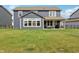 Spacious backyard view features a well-maintained lawn and a patio, perfect for outdoor gatherings at 9671 Ridgecrest Ln, McCordsville, IN 46055