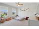 Bright bedroom with decor and windows with a picturesque view at 9671 Ridgecrest Ln, McCordsville, IN 46055