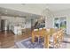 Open concept dining area with modern lighting and easy access to the kitchen at 9671 Ridgecrest Ln, McCordsville, IN 46055
