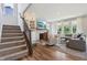 Inviting living room with fireplace, built-in shelving, and seamless connection to the staircase at 9671 Ridgecrest Ln, McCordsville, IN 46055