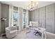 Bright and airy office with large windows, modern furnishings, and a calming gray color scheme at 9671 Ridgecrest Ln, McCordsville, IN 46055