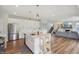 Open concept layout with sightlines from the kitchen to the fireplace in the living room at 9671 Ridgecrest Ln, McCordsville, IN 46055