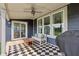 Covered patio featuring a ceiling fan, black and white rug, a sofa and outdoor furniture at 9671 Ridgecrest Ln, McCordsville, IN 46055