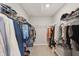 Walk-in closet with custom shelving for clothing and accessories storage at 9671 Ridgecrest Ln, McCordsville, IN 46055