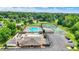 An aerial view of a community featuring a pool, tennis courts, and parking at 1000 Leisure Ln, Greenwood, IN 46142