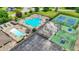 An aerial view features the community pool, tennis courts, and parking lot at 1000 Leisure Ln, Greenwood, IN 46142
