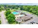 An aerial view shows tennis courts and a swimming pool within the community at 1000 Leisure Ln, Greenwood, IN 46142
