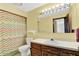 Bathroom featuring a neutral sink counter, toilet, and shower with a colorful curtain at 1000 Leisure Ln, Greenwood, IN 46142