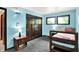 Bright bedroom featuring a window, carpet floors, and closet at 1000 Leisure Ln, Greenwood, IN 46142
