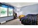 Cozy bedroom featuring natural light from a large window, perfect for relaxation and rest at 1000 Leisure Ln, Greenwood, IN 46142