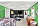 Spacious bedroom with built-in desk and shelving, complemented by neutral carpeting and modern decor at 1000 Leisure Ln, Greenwood, IN 46142