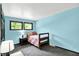 Bedroom with natural light through windows, carpeted floors, and a single bed at 1000 Leisure Ln, Greenwood, IN 46142