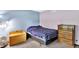 Comfortable bedroom featuring neutral tones, soft carpeting, and a chest for storage at 1000 Leisure Ln, Greenwood, IN 46142