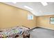 This bedroom features carpeted floors, two windows, and a twin-sized bed at 1000 Leisure Ln, Greenwood, IN 46142