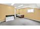 This bedroom features carpeted floors, one window, a closet, a twin-sized bed, and toys at 1000 Leisure Ln, Greenwood, IN 46142