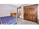 Comfortable bedroom featuring neutral tones, soft carpeting, with view of an open door at 1000 Leisure Ln, Greenwood, IN 46142