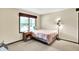 Serene bedroom features neutral tones, a bedside table, and a window for natural light at 1000 Leisure Ln, Greenwood, IN 46142