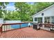Inviting deck with a barbecue grill, overlooking the pristine blue pool at 1000 Leisure Ln, Greenwood, IN 46142