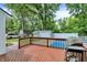 The deck has a barbecue grill that overlooks the backyard and pool, which is perfect for outdoor fun at 1000 Leisure Ln, Greenwood, IN 46142