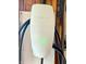 Tesla electric vehicle charger with black cords shown indoors at 1000 Leisure Ln, Greenwood, IN 46142