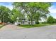 A charming two-story home with a large front lawn and mature trees at 1000 Leisure Ln, Greenwood, IN 46142