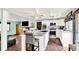 A modern kitchen with white cabinets, stainless steel appliances, and a large island with seating at 1000 Leisure Ln, Greenwood, IN 46142