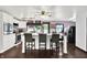 Well-lit kitchen featuring a granite island with seating, stainless steel appliances and white cabinetry at 1000 Leisure Ln, Greenwood, IN 46142