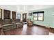 Inviting living room with plush seating and dark hardwood floors, creating a comfortable atmosphere at 1000 Leisure Ln, Greenwood, IN 46142