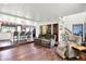 Spacious open concept living room with fireplace and bar-height seating in the kitchen at 1000 Leisure Ln, Greenwood, IN 46142