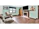 Bright living room with a decorative fireplace and mantle creating a great focal point at 1000 Leisure Ln, Greenwood, IN 46142