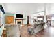 Open concept living room with fireplace, view to kitchen with large island and counter seating at 1000 Leisure Ln, Greenwood, IN 46142