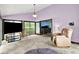 Living room featuring neutral carpet, an open layout, and comfortable seating at 1000 Leisure Ln, Greenwood, IN 46142