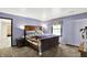 Main bedroom with carpet, natural light from one window, and neutral-colored walls at 1000 Leisure Ln, Greenwood, IN 46142
