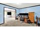 A cozy office with a large desk, dual monitors, and access to a sunroom at 1000 Leisure Ln, Greenwood, IN 46142