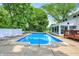 A stunning blue swimming pool with a concrete deck and lounge chairs for ultimate relaxation and summer fun at 1000 Leisure Ln, Greenwood, IN 46142