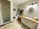 Neutral bathroom with walk in shower, neutral tile flooring, and updated vanity at 1008 Whispering Trl, Greenfield, IN 46140